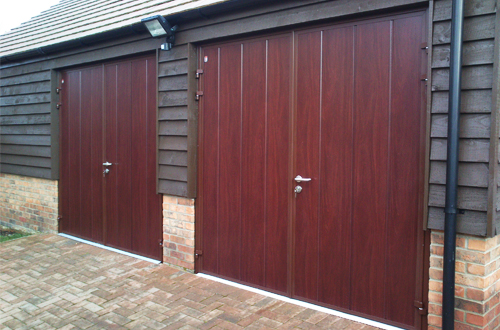 Insulated side hinged garage doors